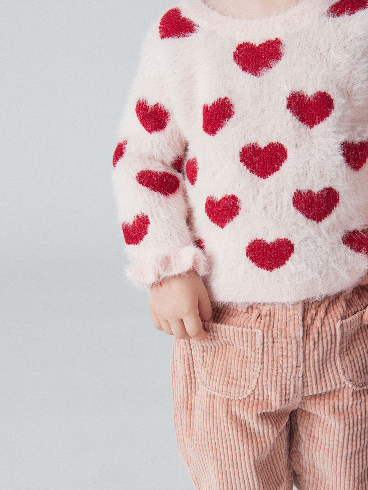 Pull rose craie à motif cœurs pour bébé fille