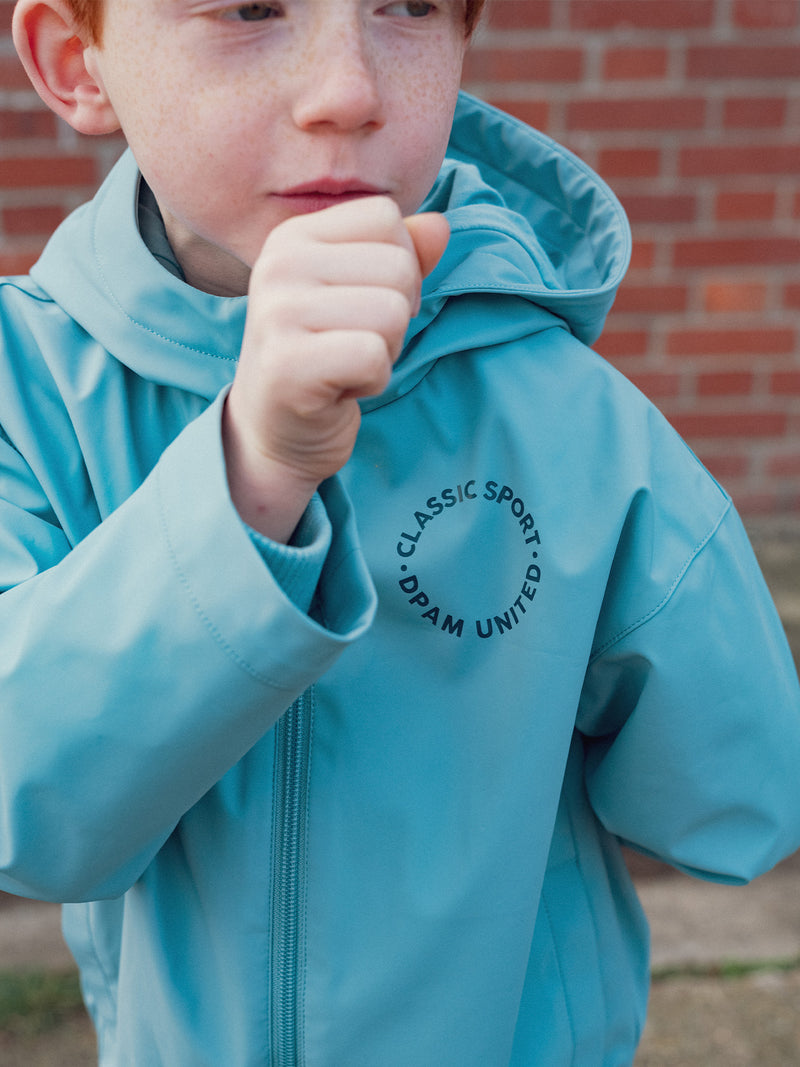 Capa de chuva azul com capuz para menino