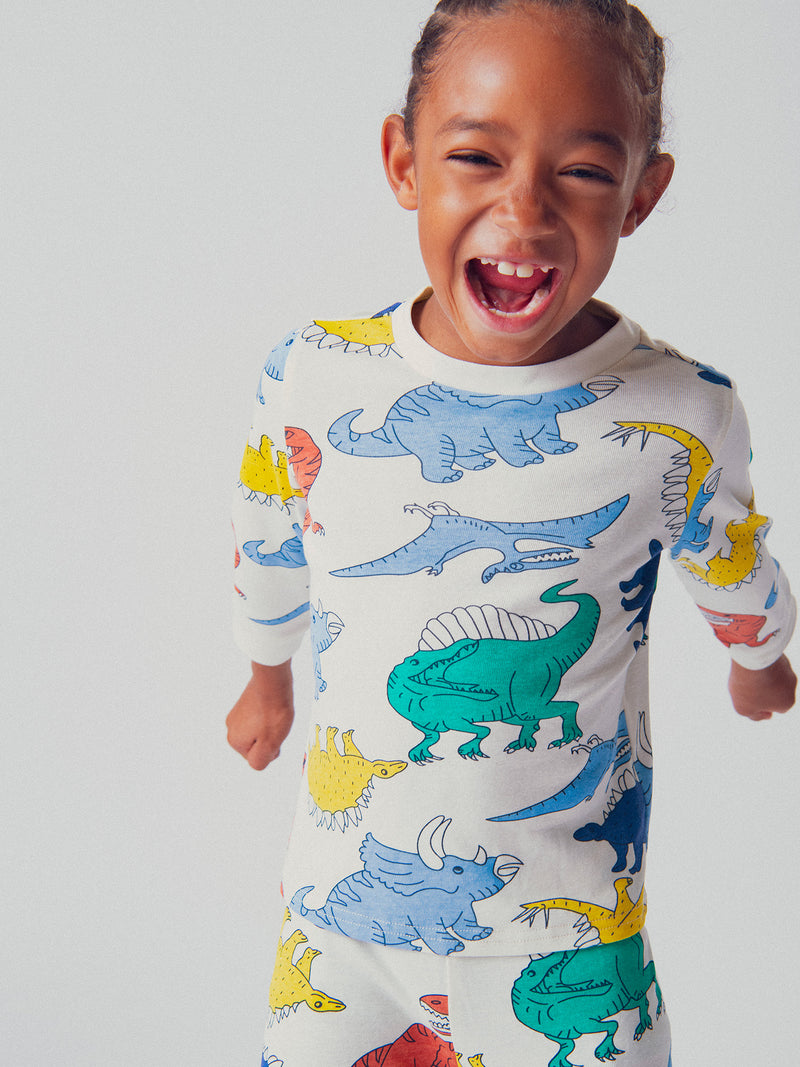 Pijama ecru com estampa de dinossauro para meninos