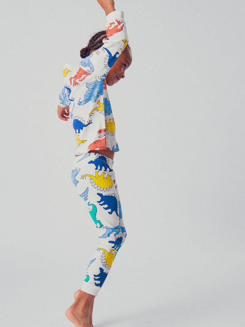 Pijama ecru com estampa de dinossauro para meninos