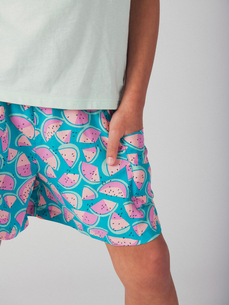 Calções azuis com estampado de melancia para meninas