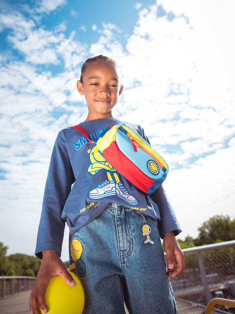 Jeans azuis estampados com chaveiro SMILEYWORLD para meninos