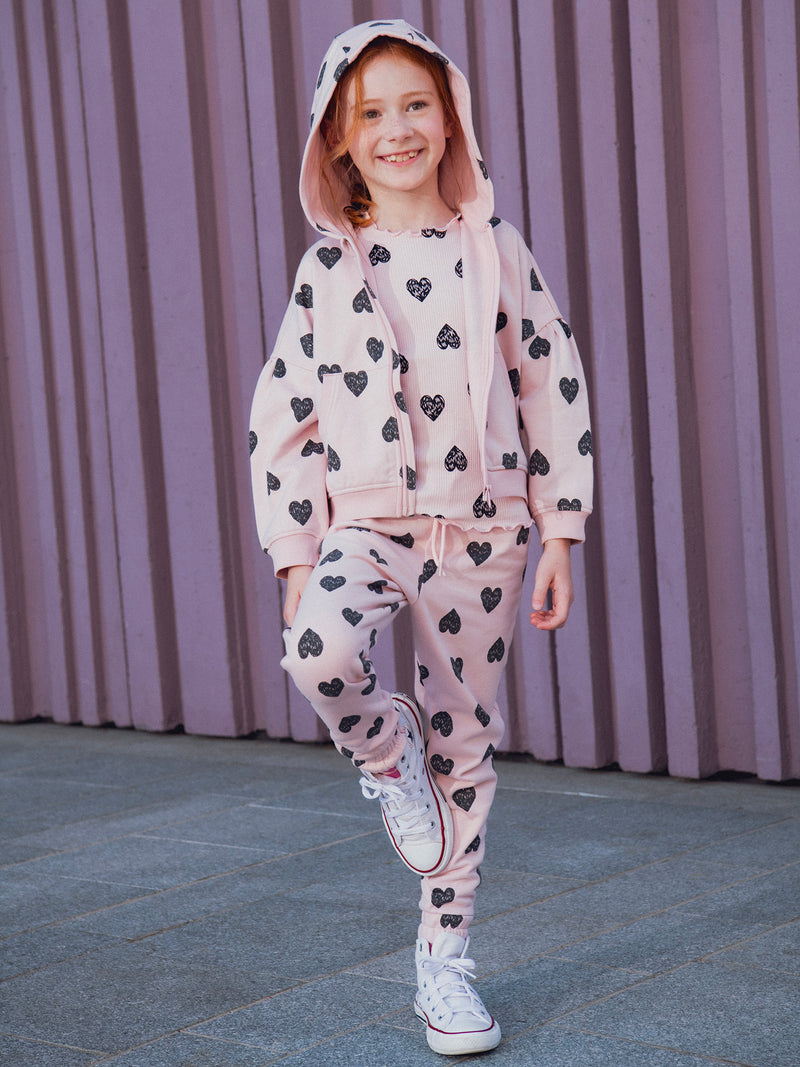 Calças de jogging rosas com estampado de corações para meninas