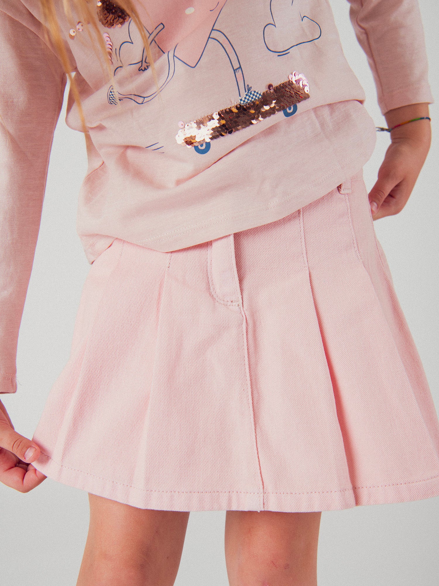 Saia curta rosa com bolsos para meninas