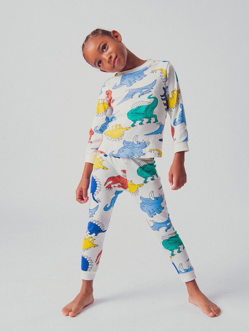 Pijama ecru com estampa de dinossauro para meninos