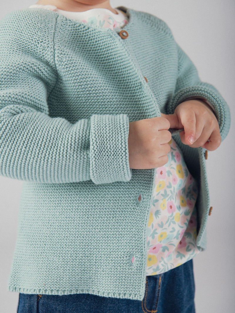Cardigan de malha azul polvorento para bebé menina
