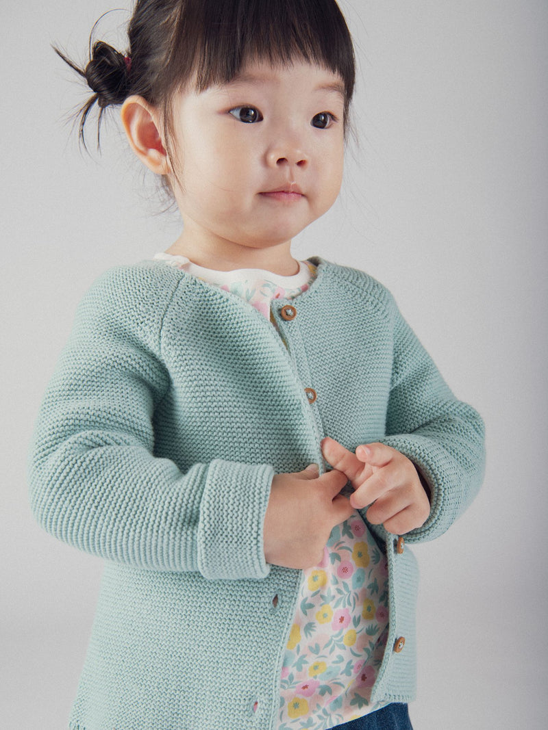 Cardigan de malha azul polvorento para bebé menina