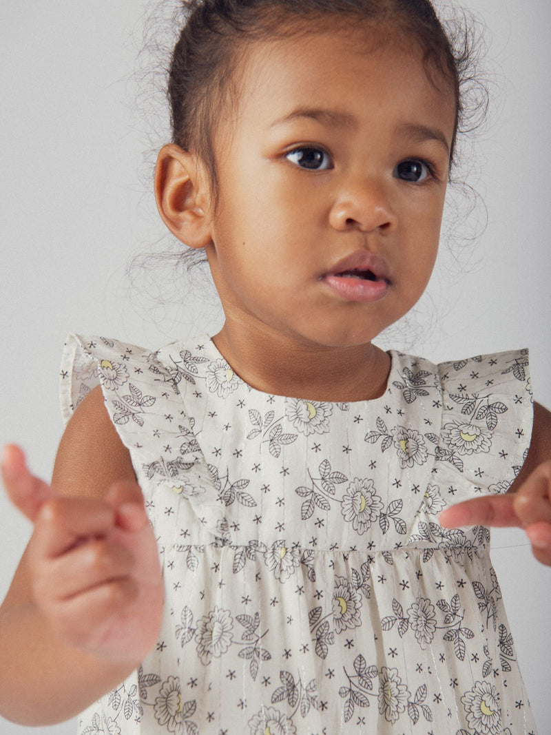 Vestido floral para menina bebé com ombros com folhos e bloomer correspondente