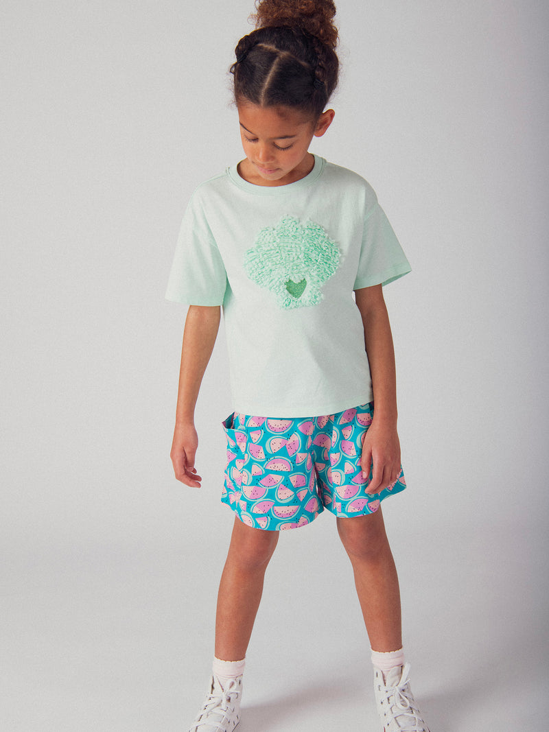 T-shirt turquesa com animação de concha 3D para meninas